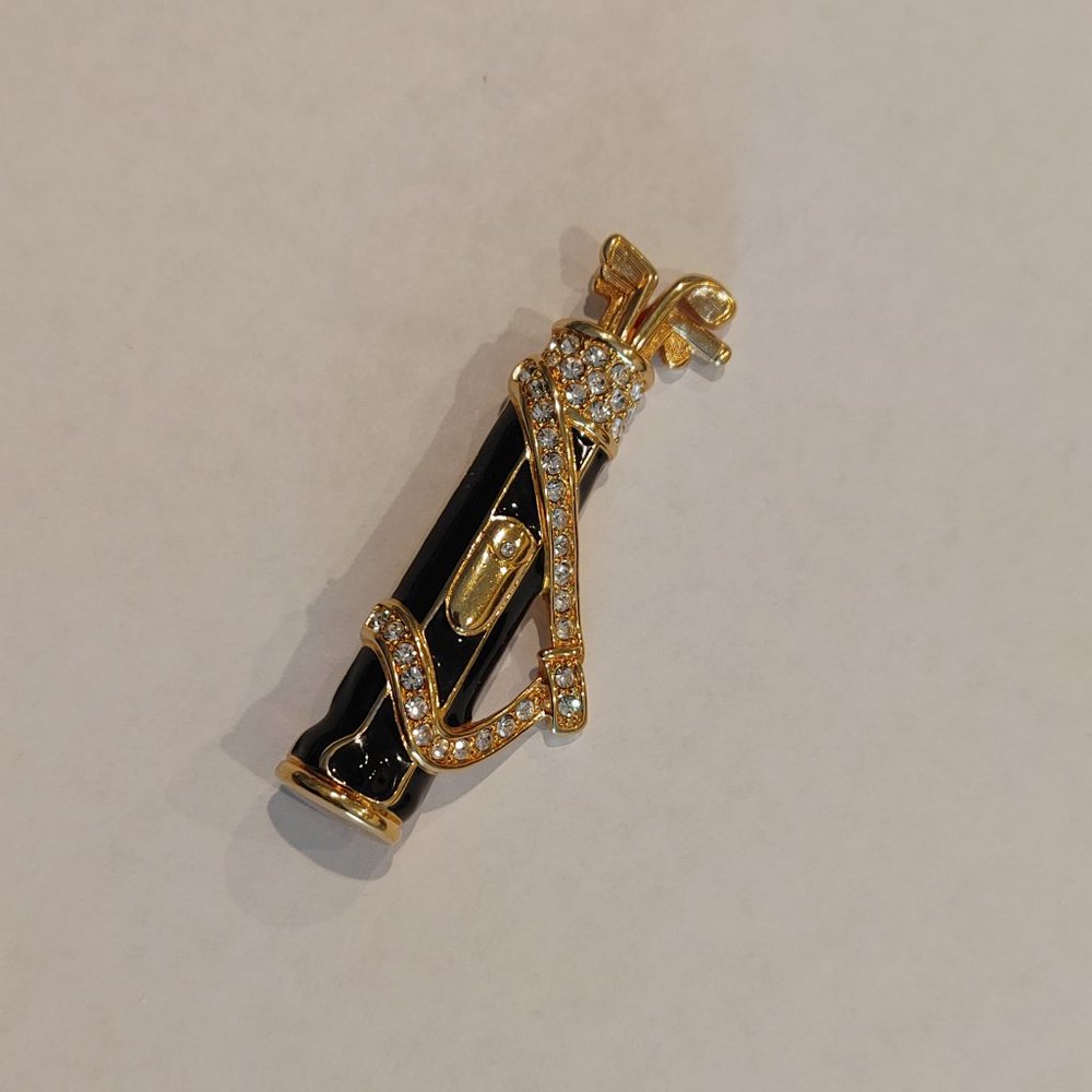 Swarovski Crystal Brooch. Golf clubs in a carrying bag, gold tone brooch.